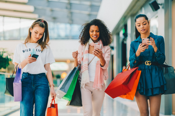 Friends spending the day in the shopping mall - Mspark Adults-shopping-smart phone