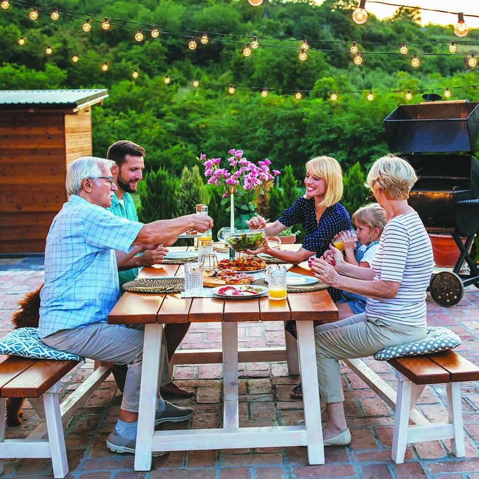 Multi-generations family gathering at dinner party in the backyard - Mspark